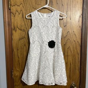 Place Sz 12. White and black lace dress.
